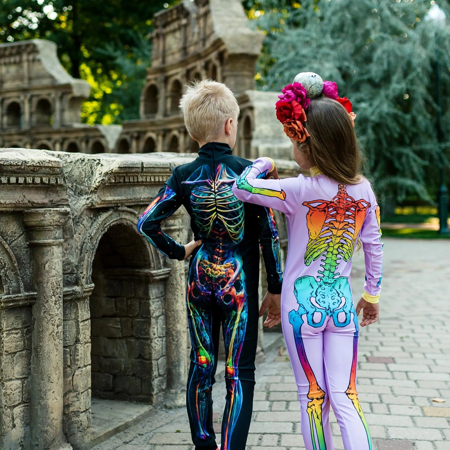 Side view of girls’ skeleton jumpsuit, crown accessory, princess costume look – Kate Princess Dress. 